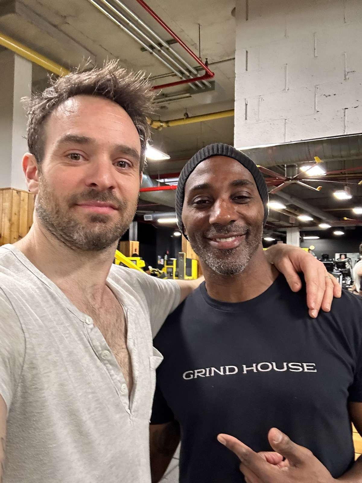 Charlie Cox poses for a photo with his trainer Naqam Washington at the gym.
