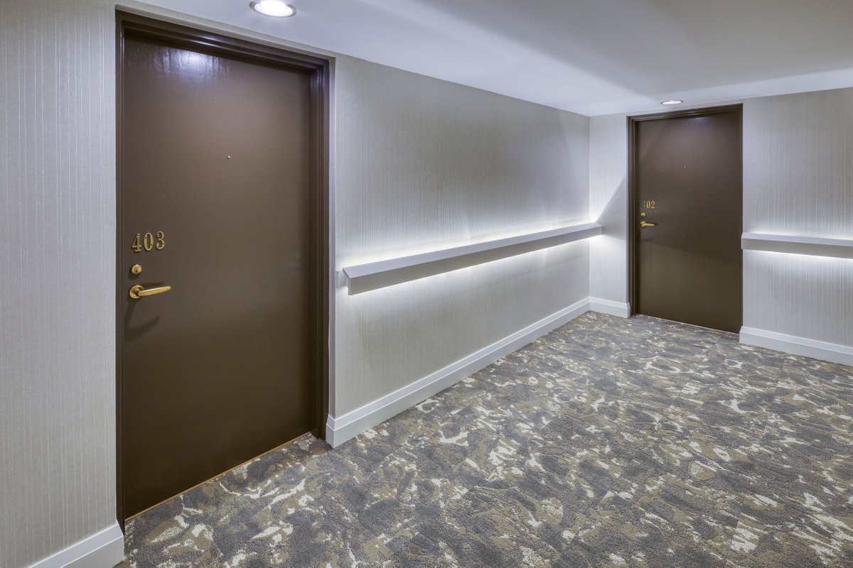 WiklemDesign's tweet photo. This condominium elevator lobby and corridor refurbishment project in Oakville certainly sets the mood with the use of lighting and a bold and organic selection of carpet tile and wallcoverings. For more photos of this project, visit: https://t.co/bCKyHR5rWK https://t.co/CHDwVrSnaC