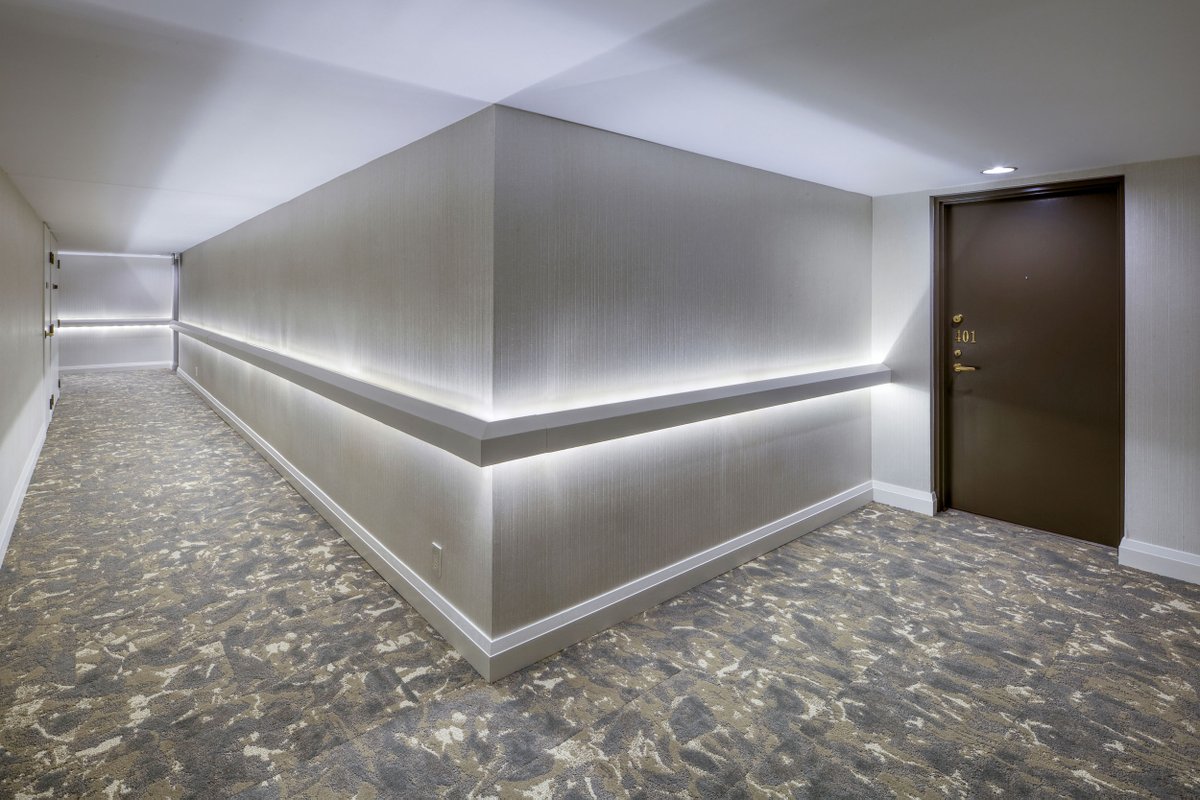 WiklemDesign's tweet photo. This condominium elevator lobby and corridor refurbishment project in Oakville certainly sets the mood with the use of lighting and a bold and organic selection of carpet tile and wallcoverings. For more photos of this project, visit: https://t.co/bCKyHR5rWK https://t.co/CHDwVrSnaC