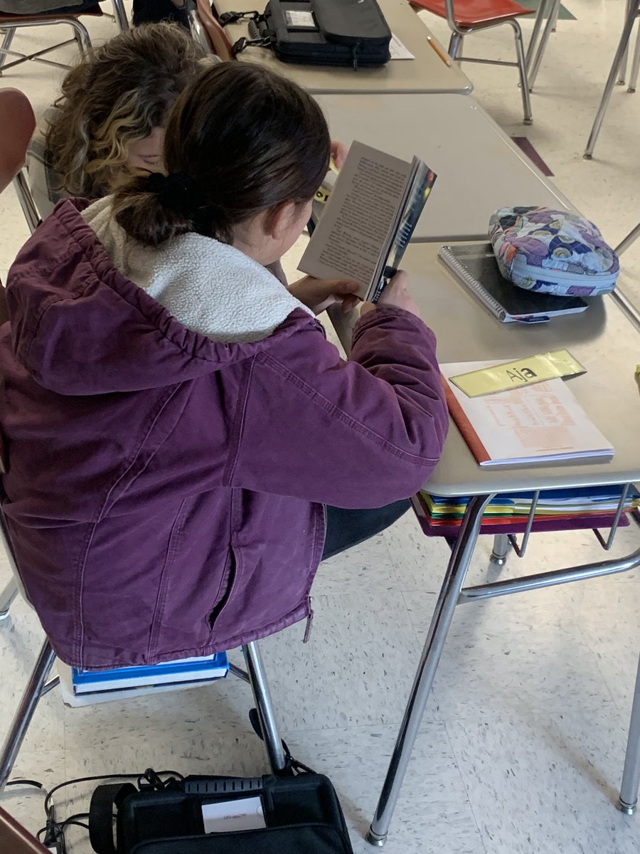 Collaboration at its finest as students work on their novel studies