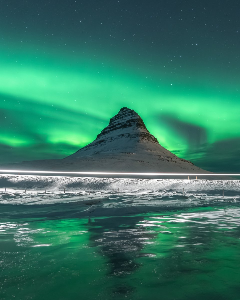 One glorious night chasing #northernlights in western #Iceland 

Here is #Kirkjufell with dancing #Auroraborealis above it, some icy reflections and crossing light trails.