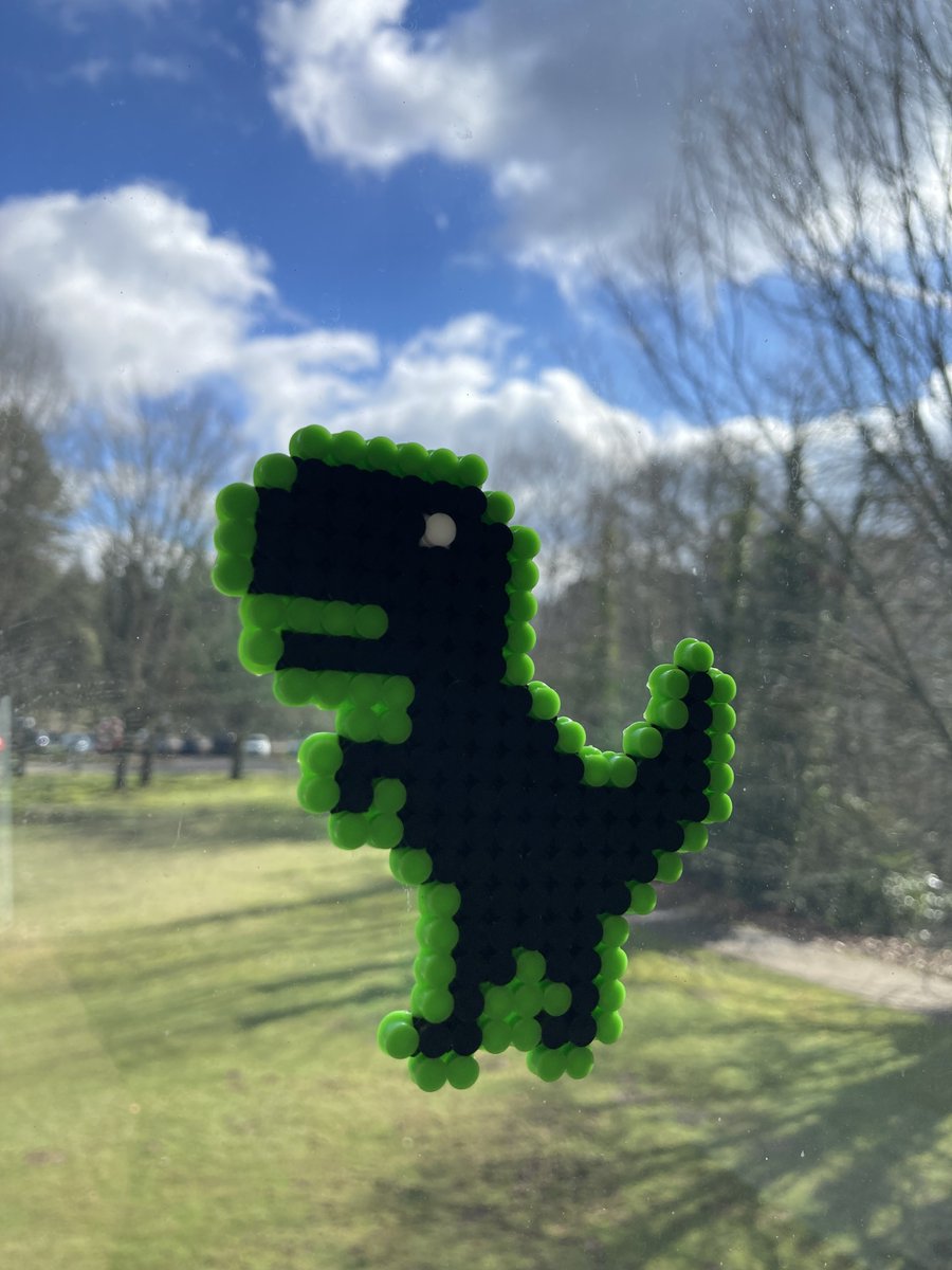 This dino wasn't rejected - he lives in one of our very best windows!