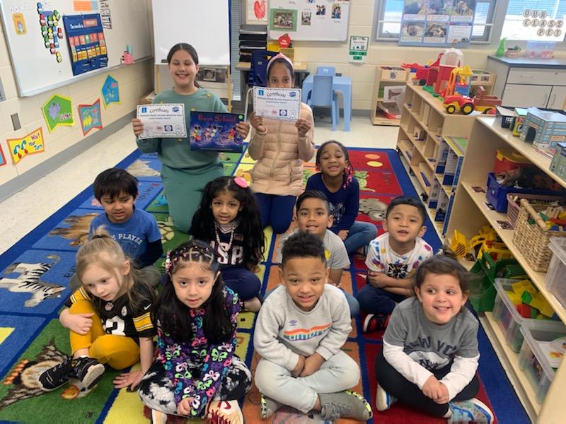 Georgiou_PreK's tweet photo. Kicking off #RAAWeek with lots of wonderful guest readers! Thank you, Coach C and 4th graders for stopping by! ๐ @MelanieCosta013 #NBTPreschoolUnited https://t.co/G0PCsETKWb