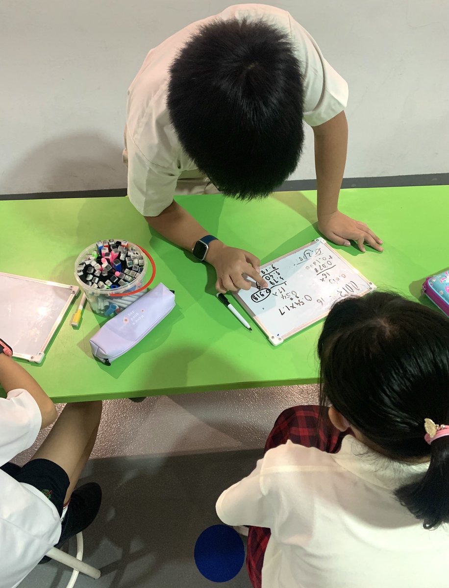 Marvellous Mathematicians and Resilient Readers in Year 7 supporting the Year 5 students. <a href="/HELPISKL/">HELP International School</a>