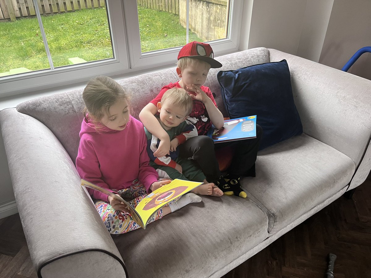 eadie_emma's tweet photo. @scambuslang Sophie and Jamie choosing an unusual place to read for #WorldBookDay2023 but perhaps the most unusual place is all sitting together on the couch…sharing! 📚 https://t.co/BvUZQ1GvuW