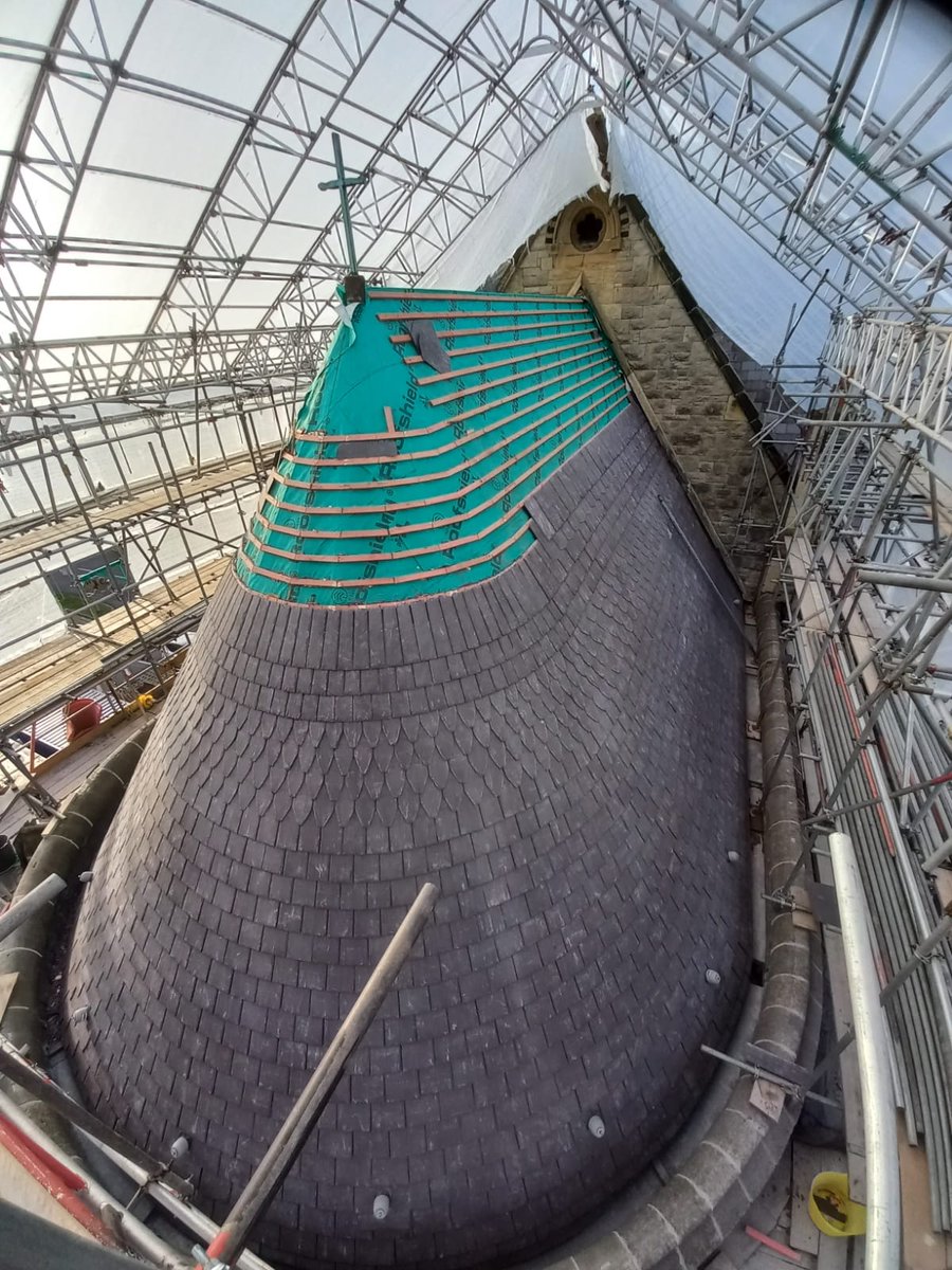 KPSArchitects's tweet photo. The setting out of the Welsh Blue Slate on the apsidal chancel roof at @HolyTrinityLlandudno has proved an unusual challenge.  #llandudno #historicalbuildings #conservation https://t.co/h91zUszuCT