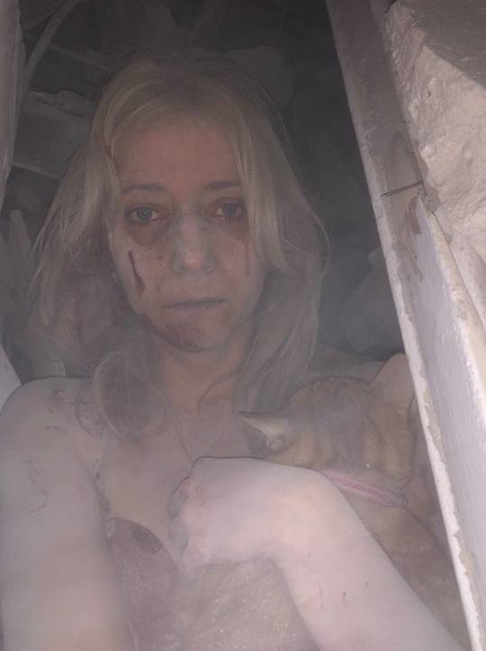 United24media's tweet photo. This woman was brave enough to post a picture of herself after Russia's attack on a residential building in Zaporizhizhia that happened this early morning. She spent 5 hours under rubble of what used to be her flat. This shouldn't happen to anyone. https://t.co/I9HPcOuYQD