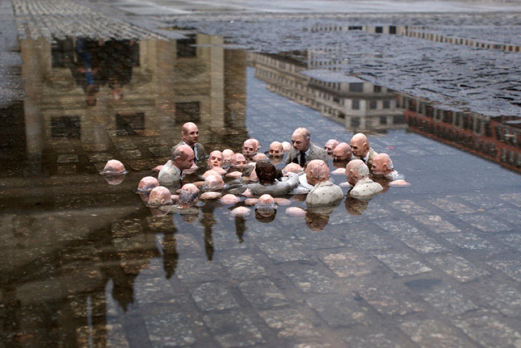 This sculpture by Isaac Cordal in Berlin is called “politicians discussing global warming”