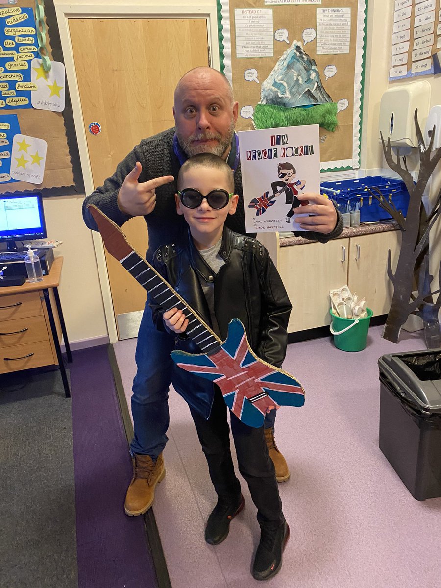 Cherylnp's tweet photo. When you work with the @Mr_HMCR, the accomplished author of @Reggie_Rockit, only 1 thing my grandson can dress up #reggierockit #WorldBookDay @SandbrookCPS https://t.co/ufbV4cTVnz