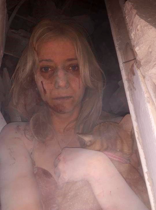 natemook's tweet photo. This is Russian terrorism. Kateryna was trapped for 5 hours with her cat under the rubble of her apartment in Zaporizhzhia today. This is the 2nd big strike this week — I was there a couple days ago when S-300 missiles hit. They are massive &amp; the impact shakes like an earthquake. https://t.co/6rit3oH0aJ