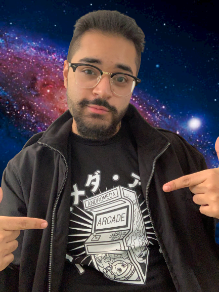 The team of <a href="/AndromedaArcade/">Andromeda Arcade 🪐</a> flew me out to Andromeda Galaxy to try on their new merch. 👾