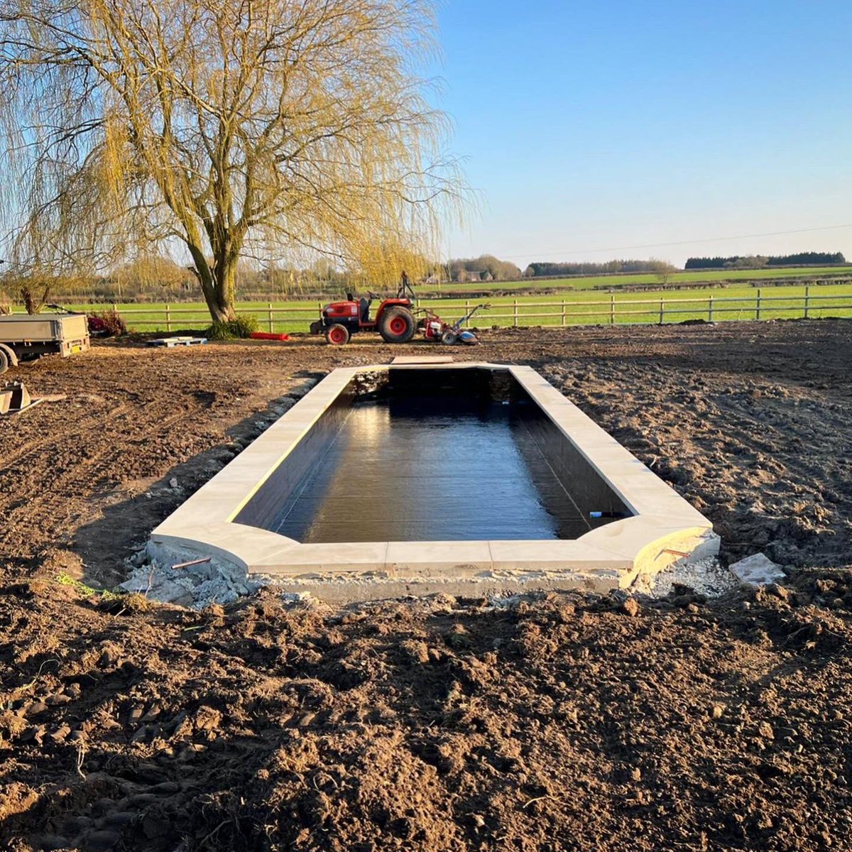 GraduateGardene's tweet photo. Our garden designer, Pippa’s project in Wiltshire is taking form. The lily pond has now been fibreglassed and the beautiful yorkstone copings from @randandasquith installed. Well done to the Graduate Gardeners team working hard on site. https://t.co/ZF2eSQdyeH