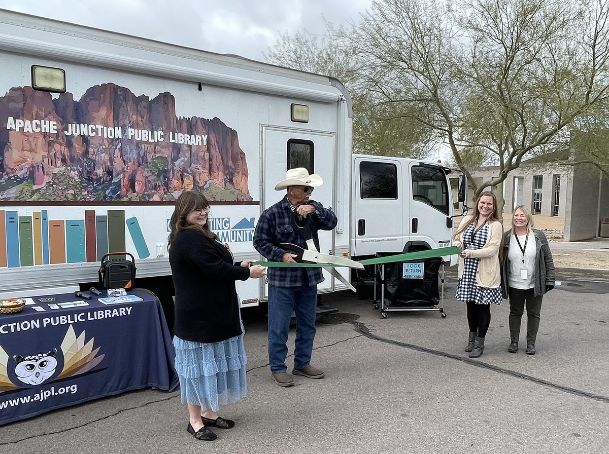 AJCityAZ's tweet photo. The Apache Junction Library cut the ribbon today on its refurbished Mobile Library. The library received a grant from the State Library to renovate the library-owned box truck that will now visit areas across the city! #ajlibrary #surroundedbylegends https://t.co/tMZA09Nzme