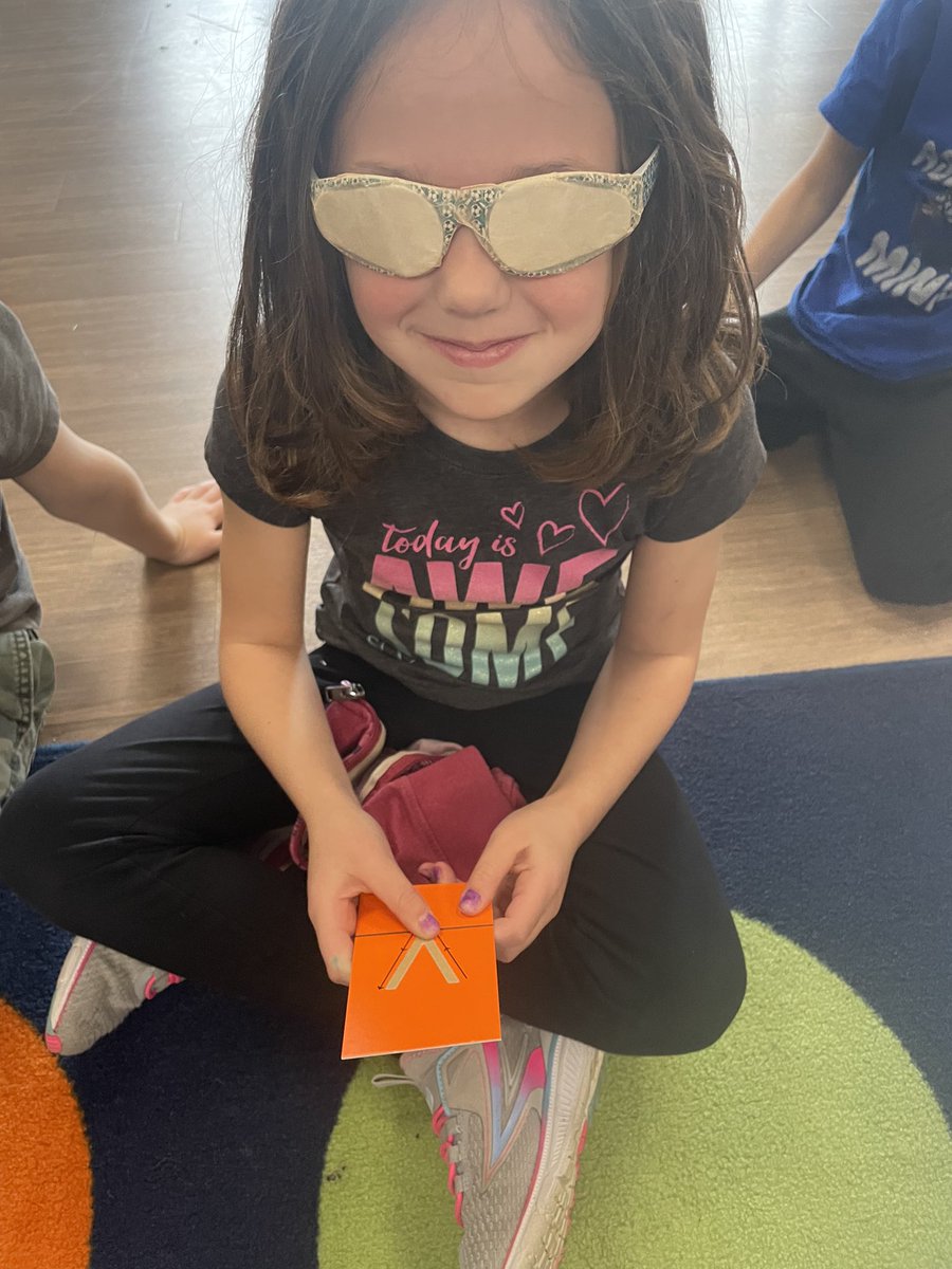 SLSDHarrisonEl's tweet photo. Kindergarten students wearing special glasses during Acceptance Week to see what it feels like to have a vision impairment and feel the sandpaper letters. https://t.co/K75rPZ4L4d