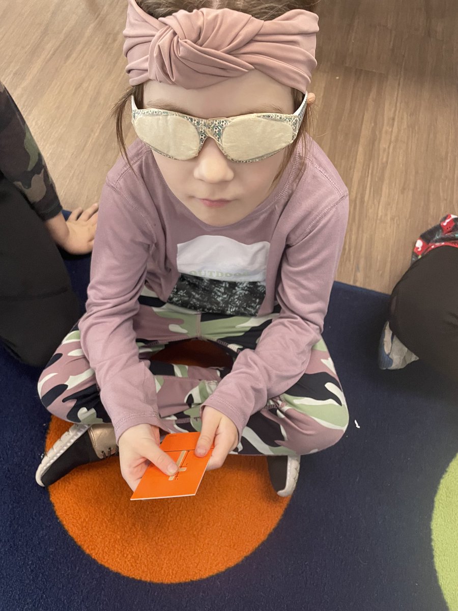 SLSDHarrisonEl's tweet photo. Kindergarten students wearing special glasses during Acceptance Week to see what it feels like to have a vision impairment and feel the sandpaper letters. https://t.co/K75rPZ4L4d