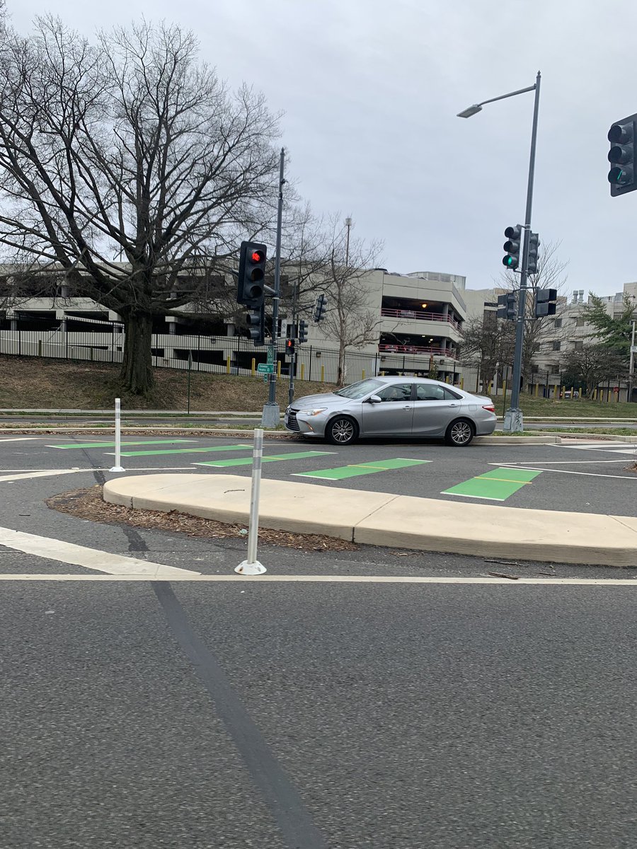 Well that’s an interesting place to get your car stuck. I’m not sure how they got there, but she’s stuck on the curb. #bikeDC