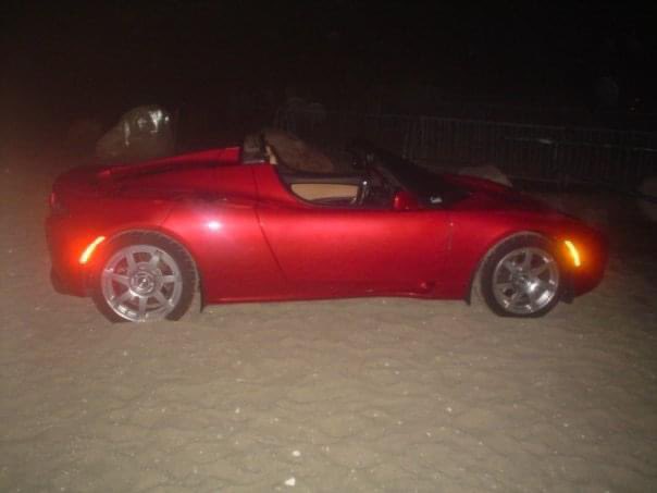NPierce1984's tweet photo. @elonmusk 2009 at a comedy show on Nantucket Island someone from Tesla got this car stuck in the sand. After a thorough explanation on how torque and sand don’t mix, my friends and I pushed this car back to the road.  14 years later, was this you? Can we take it on the beach yet? https://t.co/qTjhZNM2fW