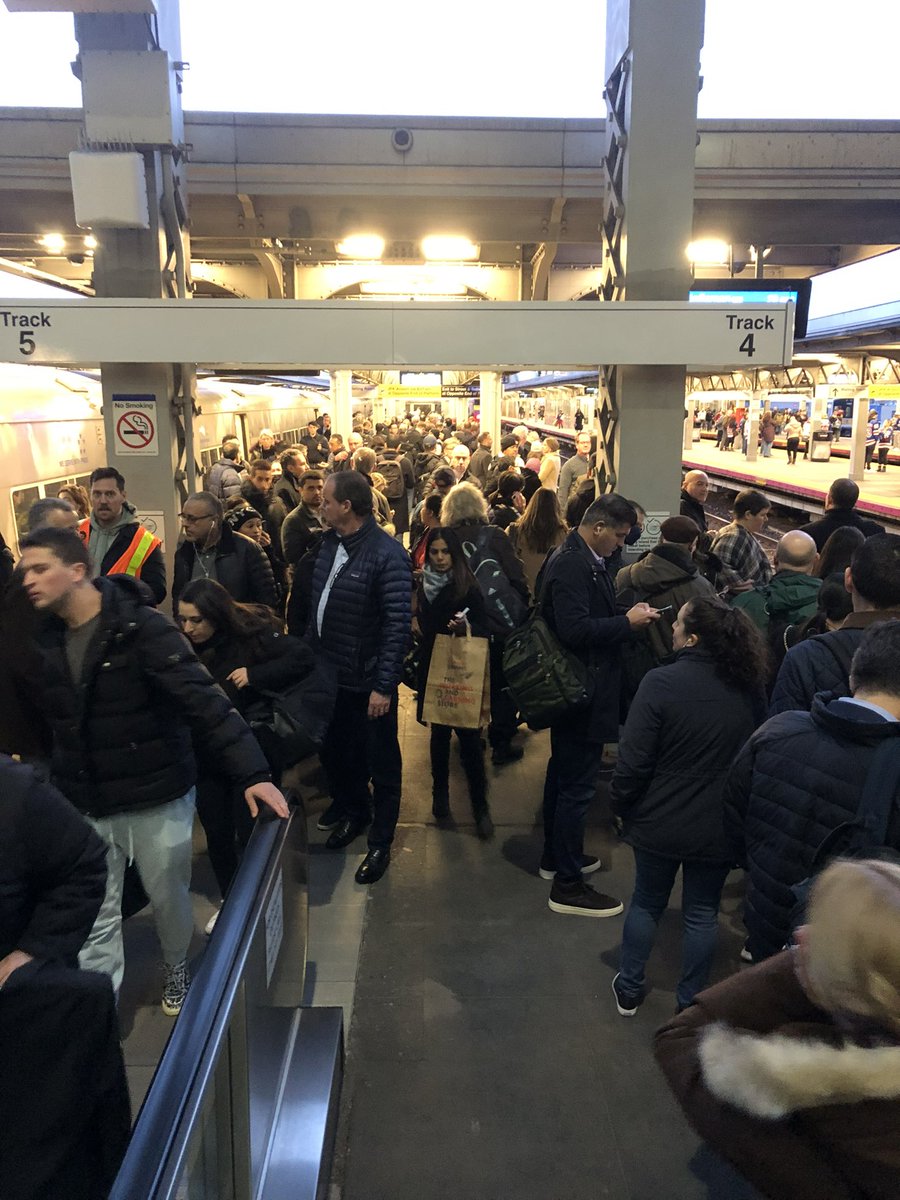 PeiSzeCheng4NY's tweet photo. #LIRR commuter John O’Hara is waiting for a connecting train at Jamaica. He says they have changed his track three times. Two trains were called for the same track at the same time and people are scrambling. #nbc4ny https://t.co/JvGDs44Z3T
