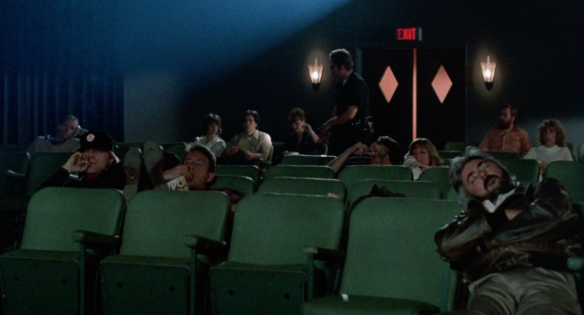 FunCityEdition's tweet photo. BREATHLESS (1983) director-co-writer Jim McBride (popcorn) &amp; his co-writer &amp; friend Kit Carson (cigarette) watching GUN CRAZY aka DEADLY AS THE FEMALE, while a cop enters w/flashlight looking for Richard Gere &amp; Valérie Kaprisky. #Breathless #JimMcBride #LMKitCarson #KitCarson https://t.co/NaDVCmiATK