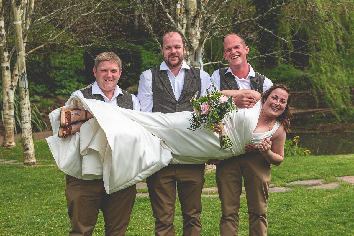 DON'T DROP THE BRIDE! We love this fun shot of bride Kim being carried by her husband and groomsmen. While it is great to have 'framer photos' this will no doubt be a favourite memory of the day too!❤️💚💙#devonweddingvenue