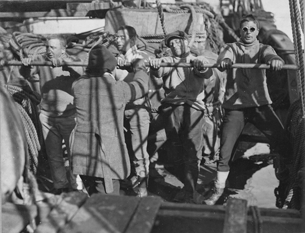 danthewhaler's tweet photo. "A chanty at the pump", the Terra Nova at sea l-r: Bowers, Cherry, Bruce, Day, back to camera - Drake. https://t.co/TZKLnUJi6I