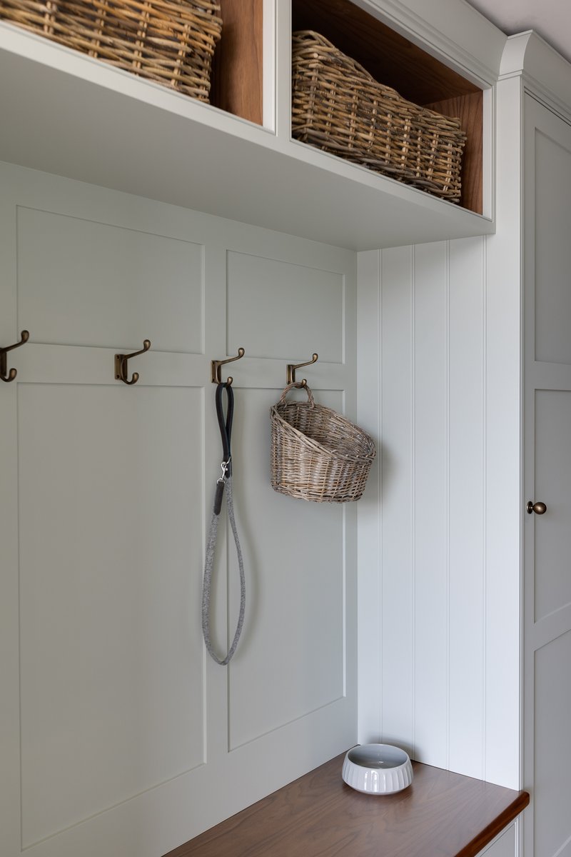 Boot room by John Ladbury in Herts. Walnut shelving and pull out drawer. #johnladbury #bootroom #bespokefurniture #bespokekitchens #walnutfurniture #hertfordkitchens #beautifulkitchens #designerkitchens #londonkitchen