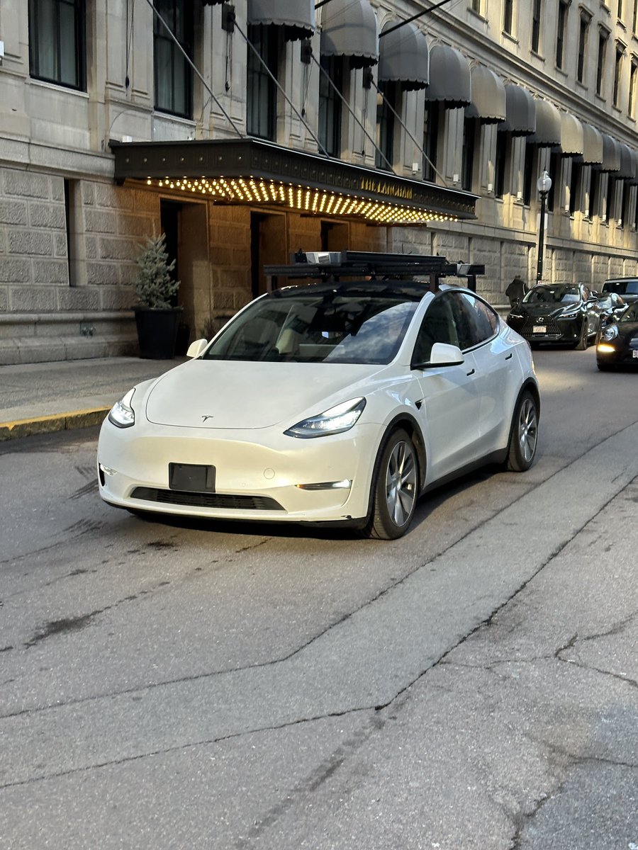 UncleWithCars's tweet photo. Nothing unusual about a Tesla with a ladder-type camera setup running around the same corner five times. https://t.co/nQp2xYzlTA