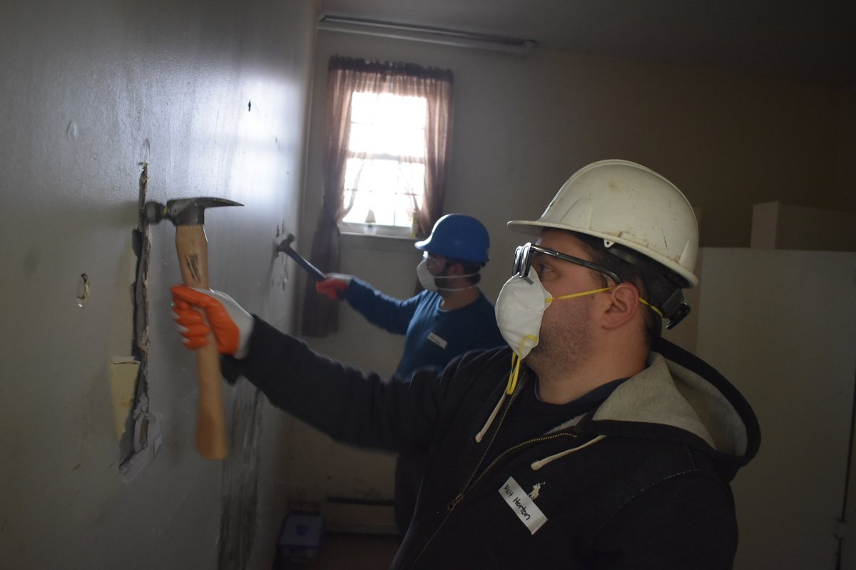 IonaPrep's tweet photo. This #EmployeeAppreciationDay, specifically one designated by @CardinalDolan for #CatholicEducators in 2021, our staff is performing service throughout the area. Here our teachers demo the basement of Emanuel AME Church in @NewRochelleNY for the @fullercenterny disaster team. https://t.co/ZZrpKU1jVx