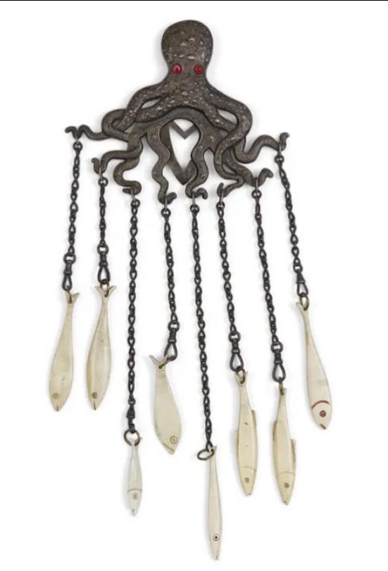 A 19th century silver octopus chatelaine with bone carved fish