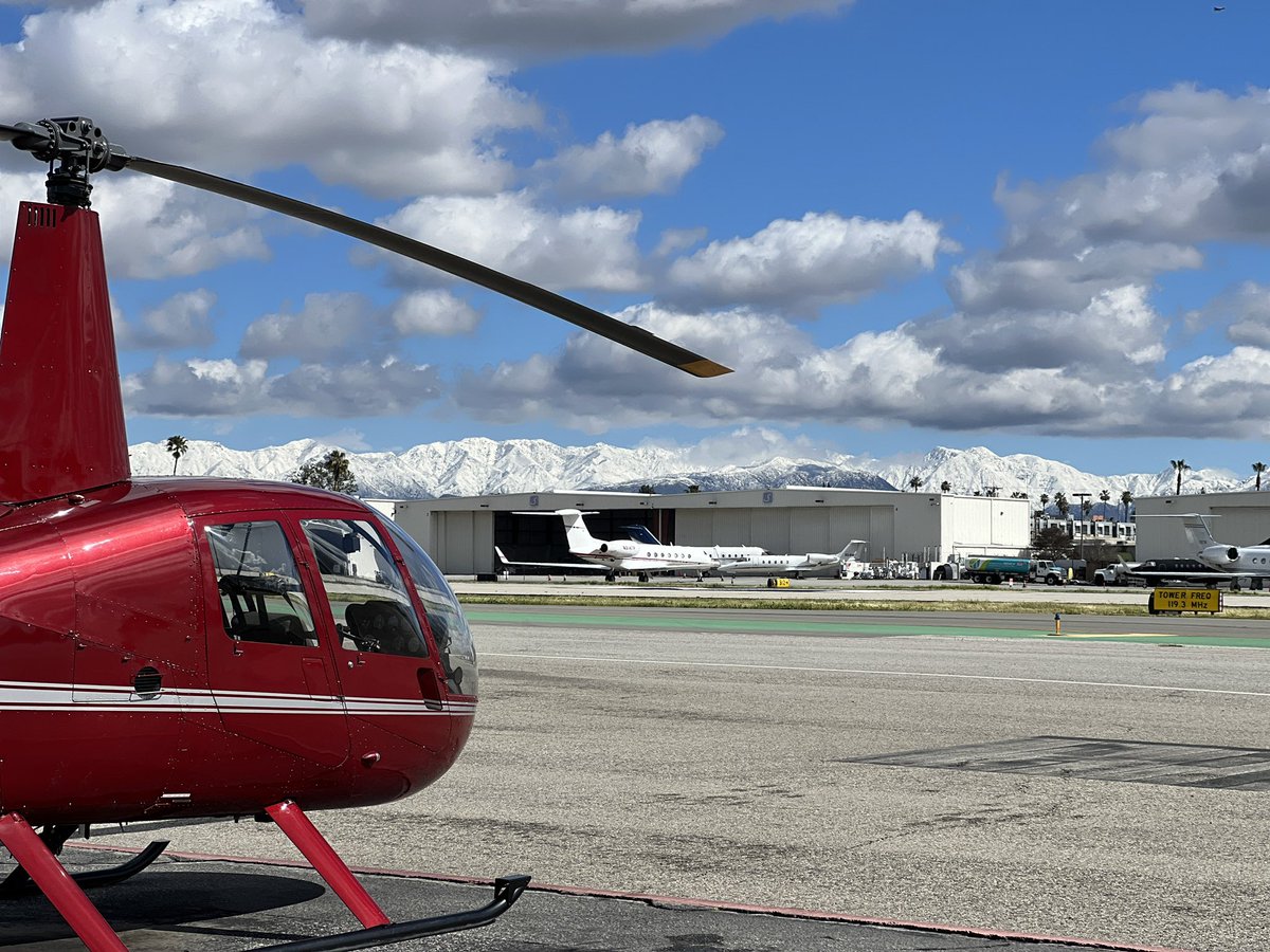 Amazing view of the snow covered Verdugo & San Gabriel Mountain ranges from our tarmac @VanNuysAirport The views of #DTLA and #HollywoodSign are quite spectacular on our helicopter tours. ❄️🚁⛄️ #SanFernandoValley #LASnow