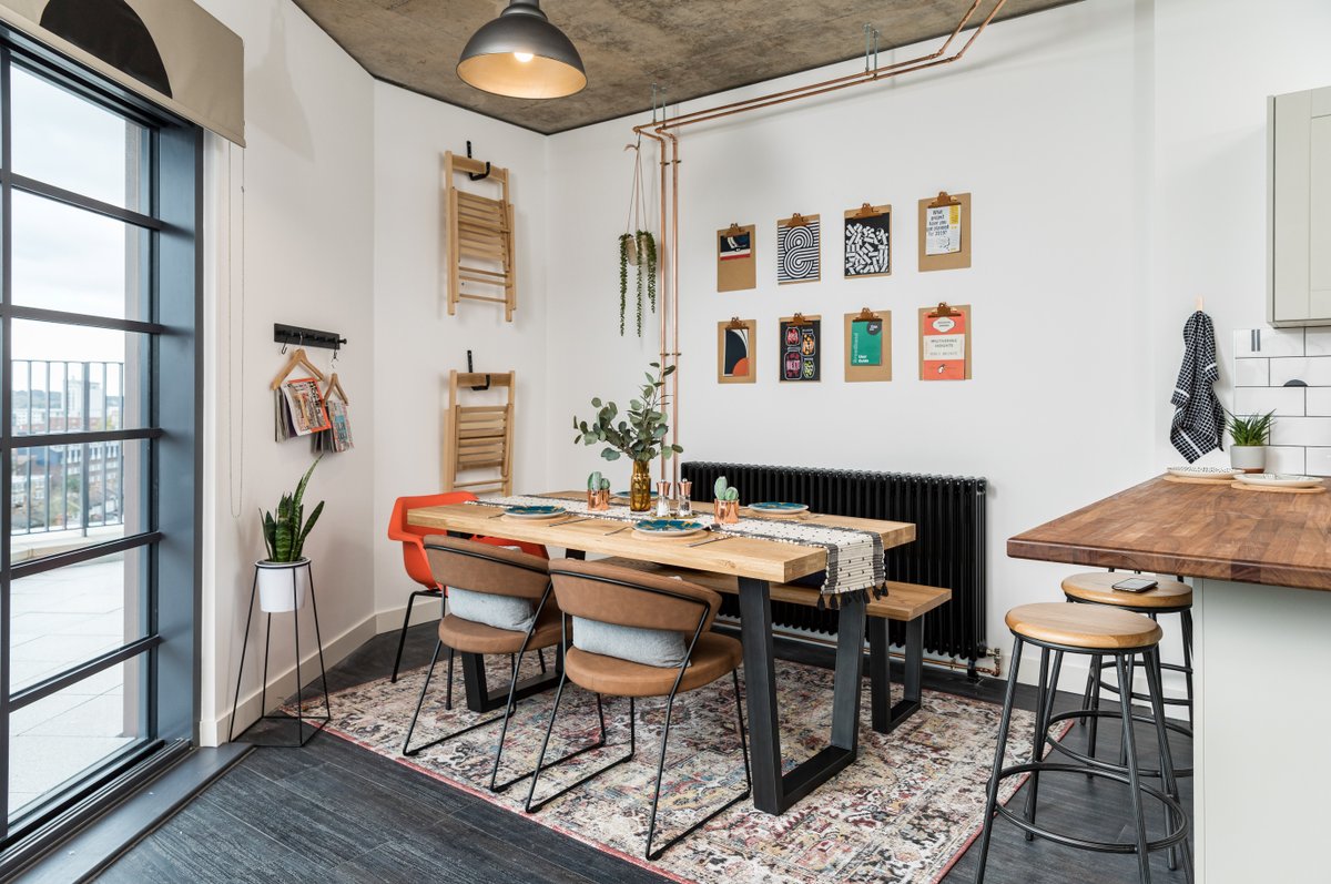 Not sure which we love most about this image, the spacious corner dining setting or the balcony windows (perfect views for all those summer sunsets) Which is your favourite? Head to our link in bio to find out more about our Ferrum apartments 🔗 Styled by @grillodesigns