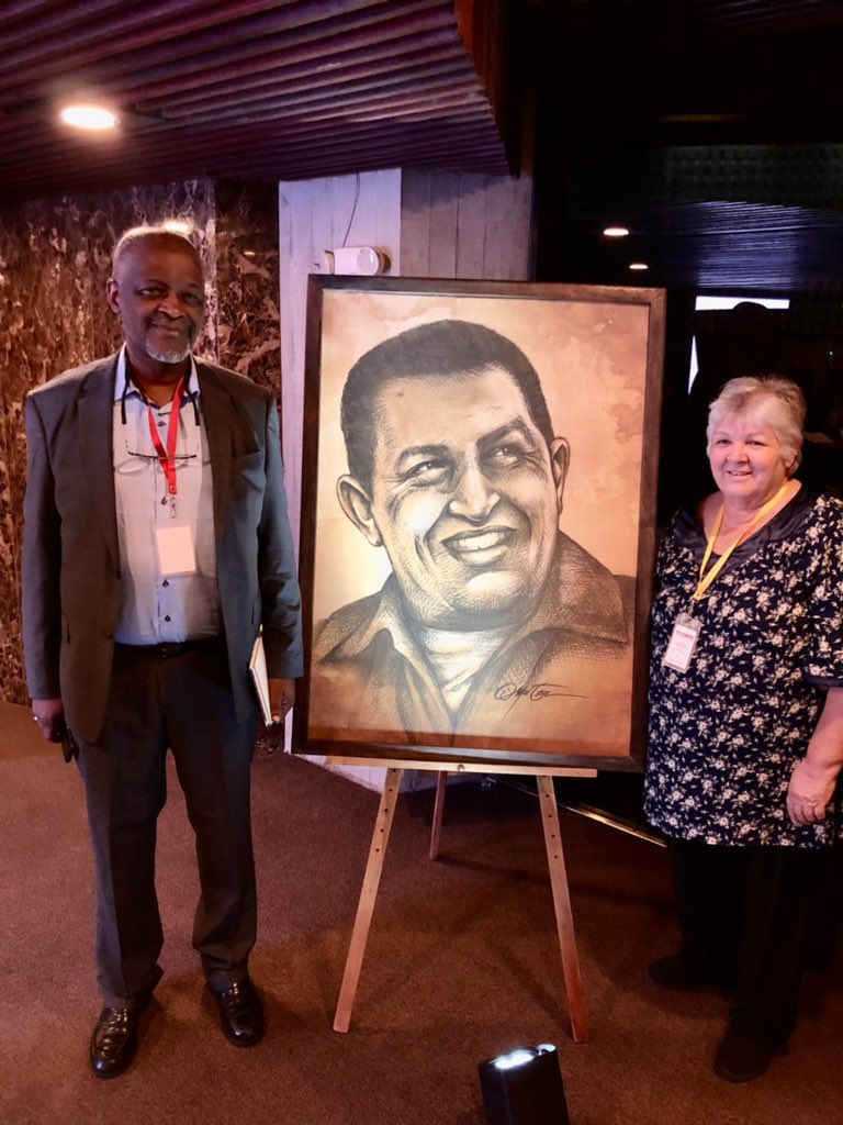 BTnewsroom's tweet photo. The son of Patrice Lumumba and the daughter of Che Guevara stand together in Caracas, Venezuela to honor Hugo Chavez on the 10th anniversary of his passing. 

No matter how hard the Empire tried, they couldn’t assassinate anti-imperialism out of existence. It’s growing again. https://t.co/CjbgikO49q