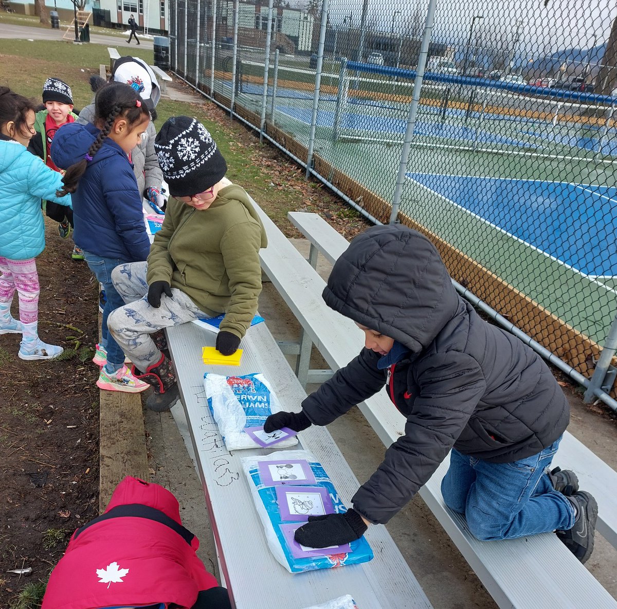 TammySiganakis's tweet photo. For our #outdooreducation walk, I read the story "Snowballs" and then the students hid cards and then went searching for others in order to sequence how to build a snowman. @Alexander__Elem @AbbotsfordSD #abbyschools #meltedsnow https://t.co/T5fG0qgglf