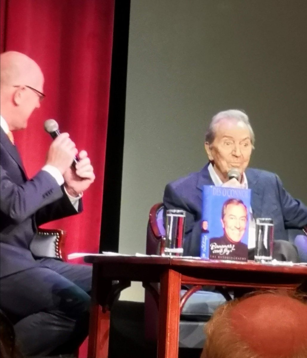 Cruisecred's tweet photo. Des O'Connor interviewing one of the great British comedians. We were lucky enough to see Des on a @PrincessCruises in 2019. He had some great stories to tell. Watch the clip, to brighten your #Saturday! #cruiseguests #cruiseship #laughter #comedy https://t.co/uVuSSGMN4z
