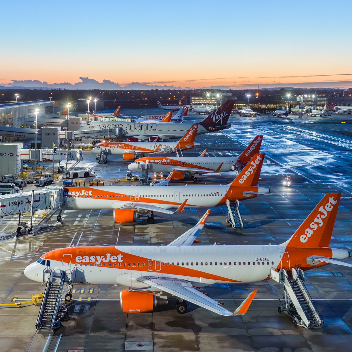 Sunrise at @Gatwick_Airport ft a familiar jumbo hiding in the lineup #easyjet @easyJet 🥕