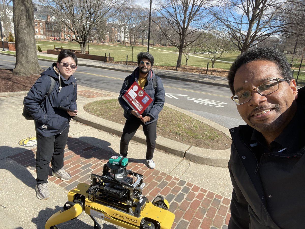 Hanging out with Tian and Adarsh from the Maryland Robotics Center taking their robot out for a walk in front of Miller Administration Building