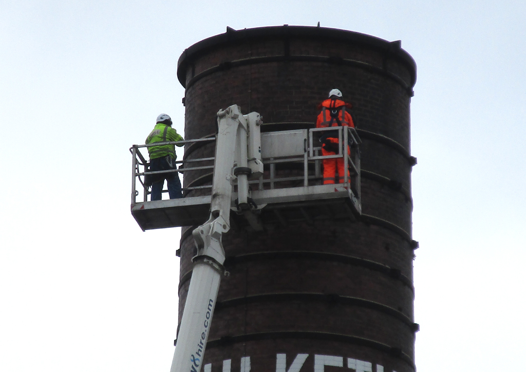 Preston’s tallest remaining mill chimney having its iron banding inspected yesterday.