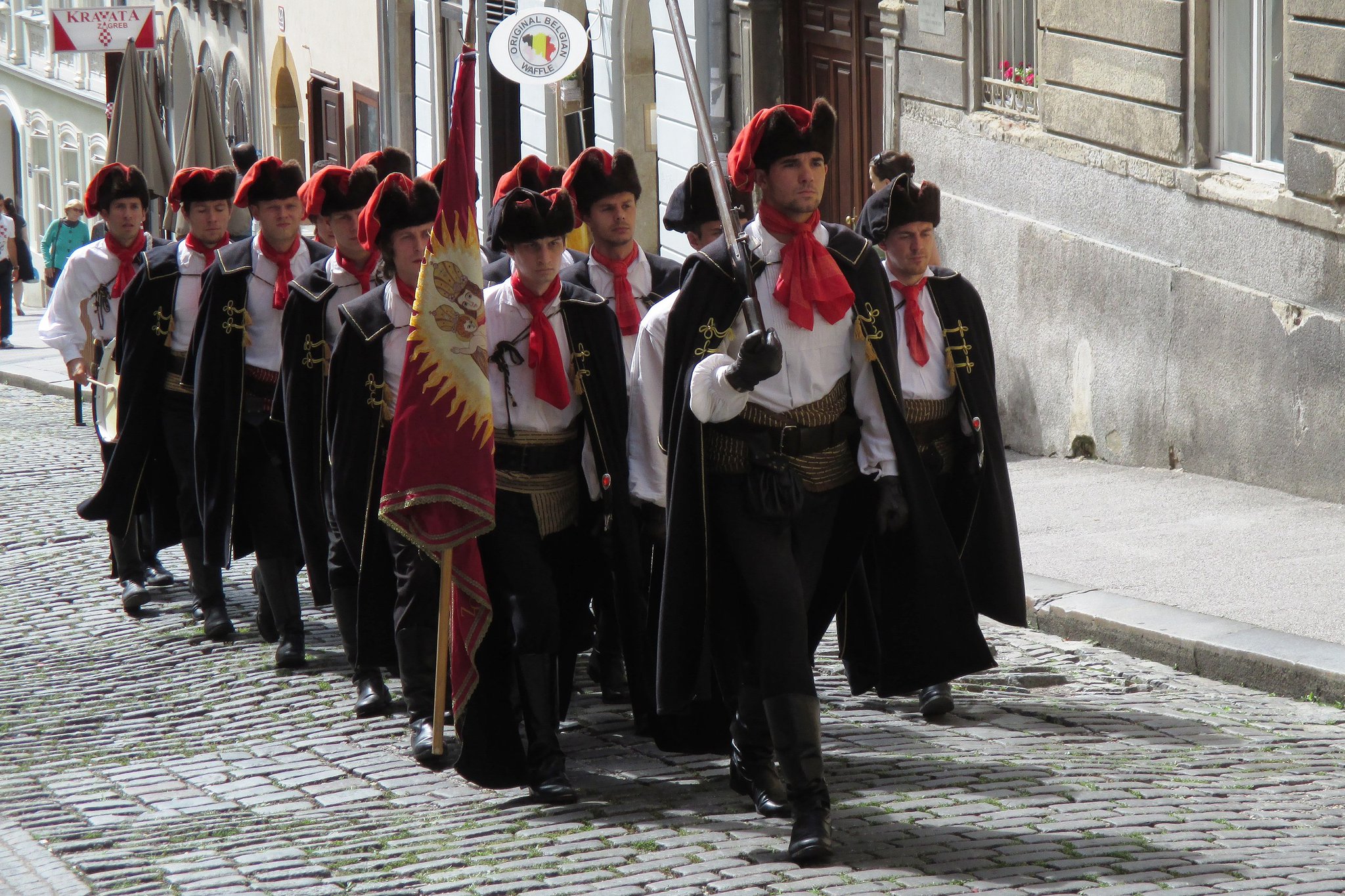 France decided to hire some soldiers from Croatia.

They wore knotted scarves around their necks to 