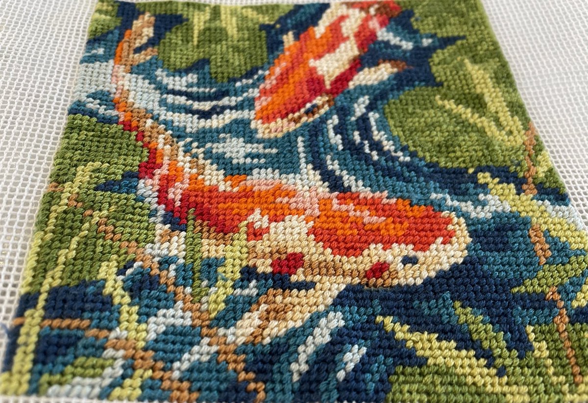 LucyYang7's tweet photo. Finally finished! I didn’t know what I was doing but it was fun to see the fishies come alive! And yes, that’s painters tape I put around the edges. Ha 

#koi #needlepoint #needlepointersofinstagram 
#christmasgift 
@abc7ny https://t.co/9n99d776Gg