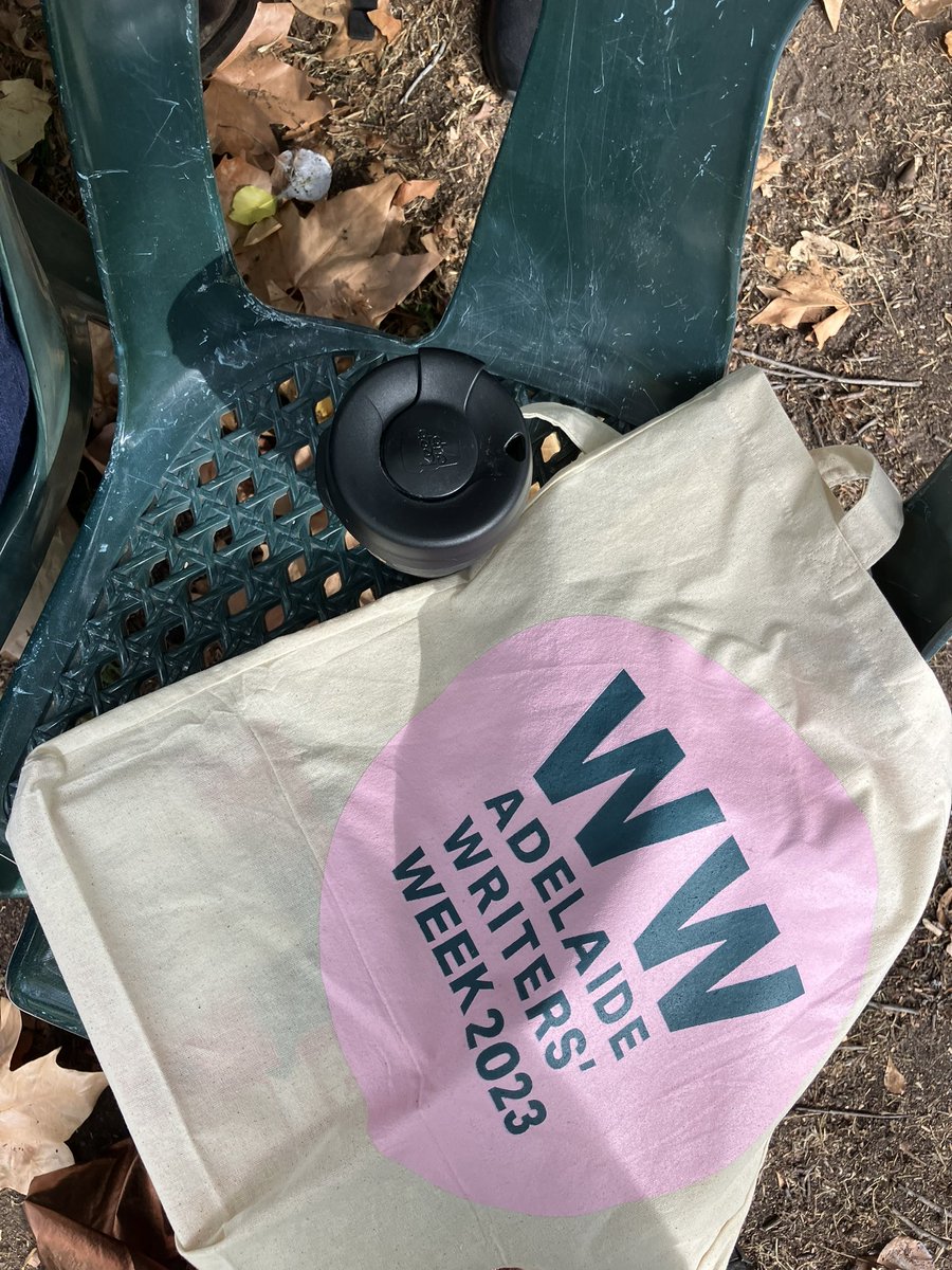 Coffee, bag, seat in the shade. Writers Week Day 2, we’re good to go! #adlww