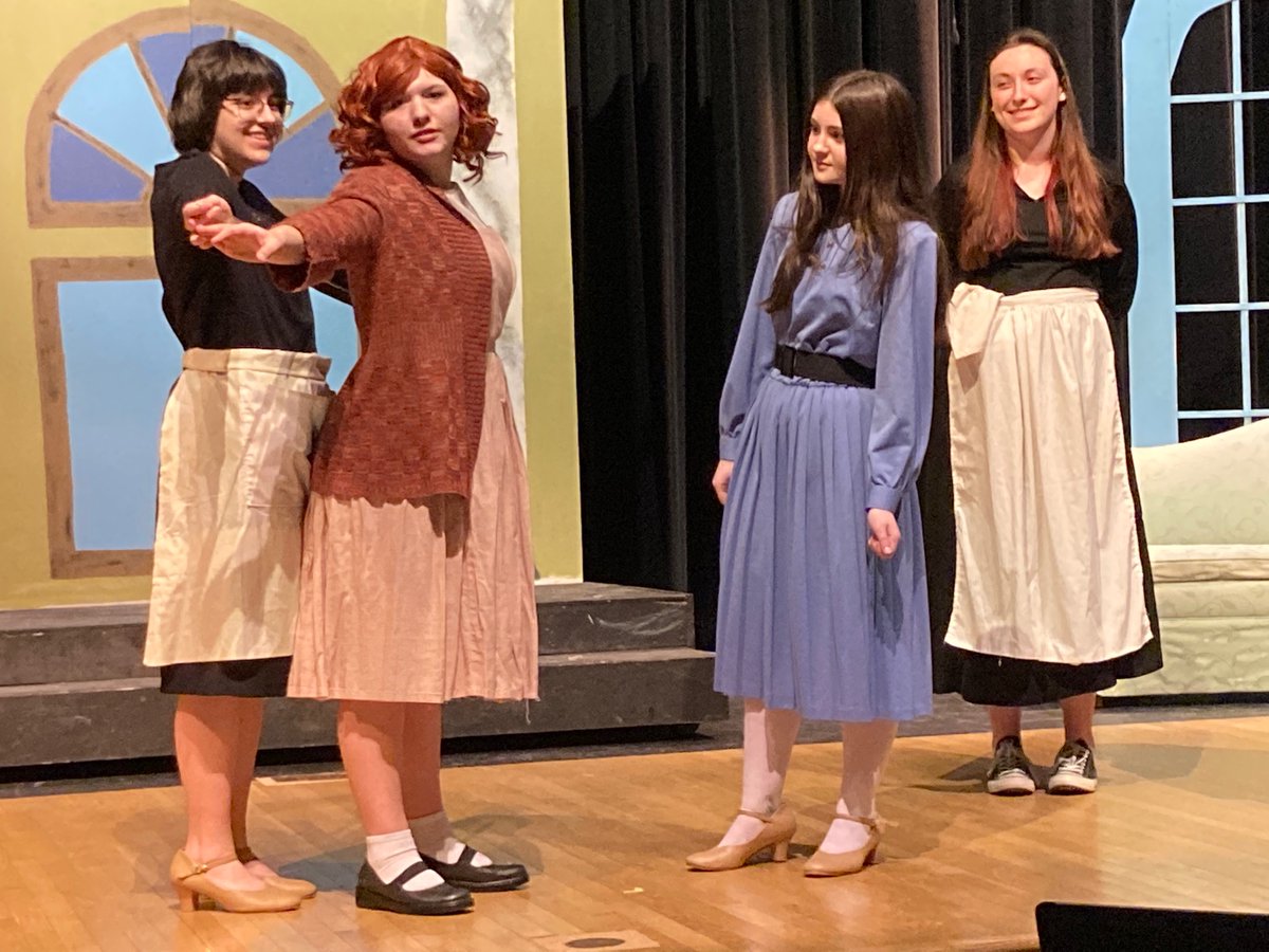 Cecille (Chloe Ellsworth) measures Annie (Cailyn King) while Grace (Aubree Black) and Mrs. Greer (Anna Maxwell) watch approvingly in the GHS production of “Annie” which opens next weekend.