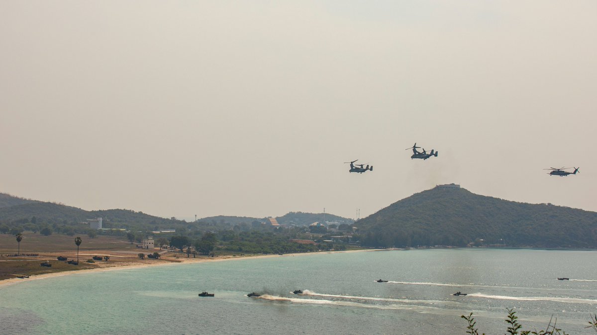 ExerciseCG's tweet photo. U.S. Marine Corps MV-22B Ospreys with Marine Medium Tiltrotor Squadron (Rein.) 362, 13th Marine Expeditionary Unit, fly over the Republic of Korea and Royal Thai Marine Corps assault amphibious vehicles during an amphibious exercise as part of Exercise Cobra Gold. https://t.co/wOVQZz6Izv