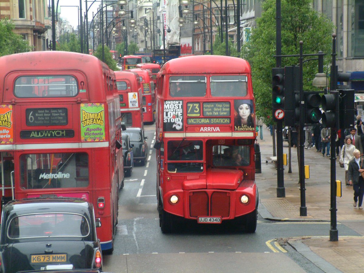 Buses along Oxford Street in Summer 2002. 
#retrolondon #routemaster #taxi