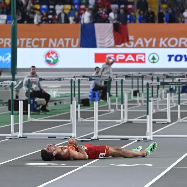 Unsportsmanlike gesture of the participants in the 60mv hurdles final with the Spanish Enrique Llopis, lying and shocked on the ground: they did not flinch