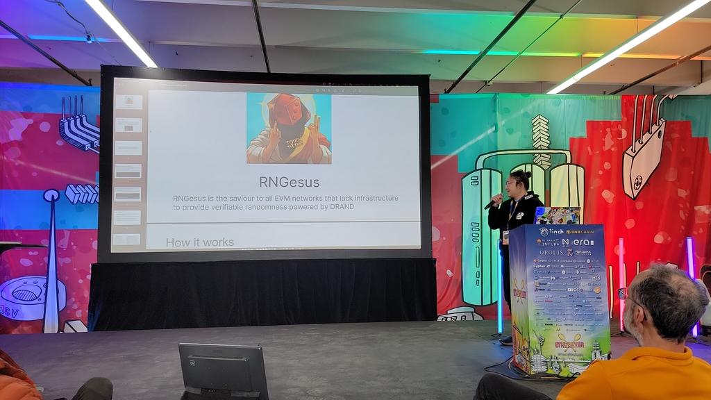 EthereumDenver's tweet photo. Check out RNGesus at the #Devtopia stage: 
•RNGesus is a DRAND oracle
•Consuming contracts may request a random beacon from the future.
•A random beacon can be proved by anyone who can supply a valid
SNARK proof of verification of the BLS signature for that round https://t.co/H8Dt53SsSM
