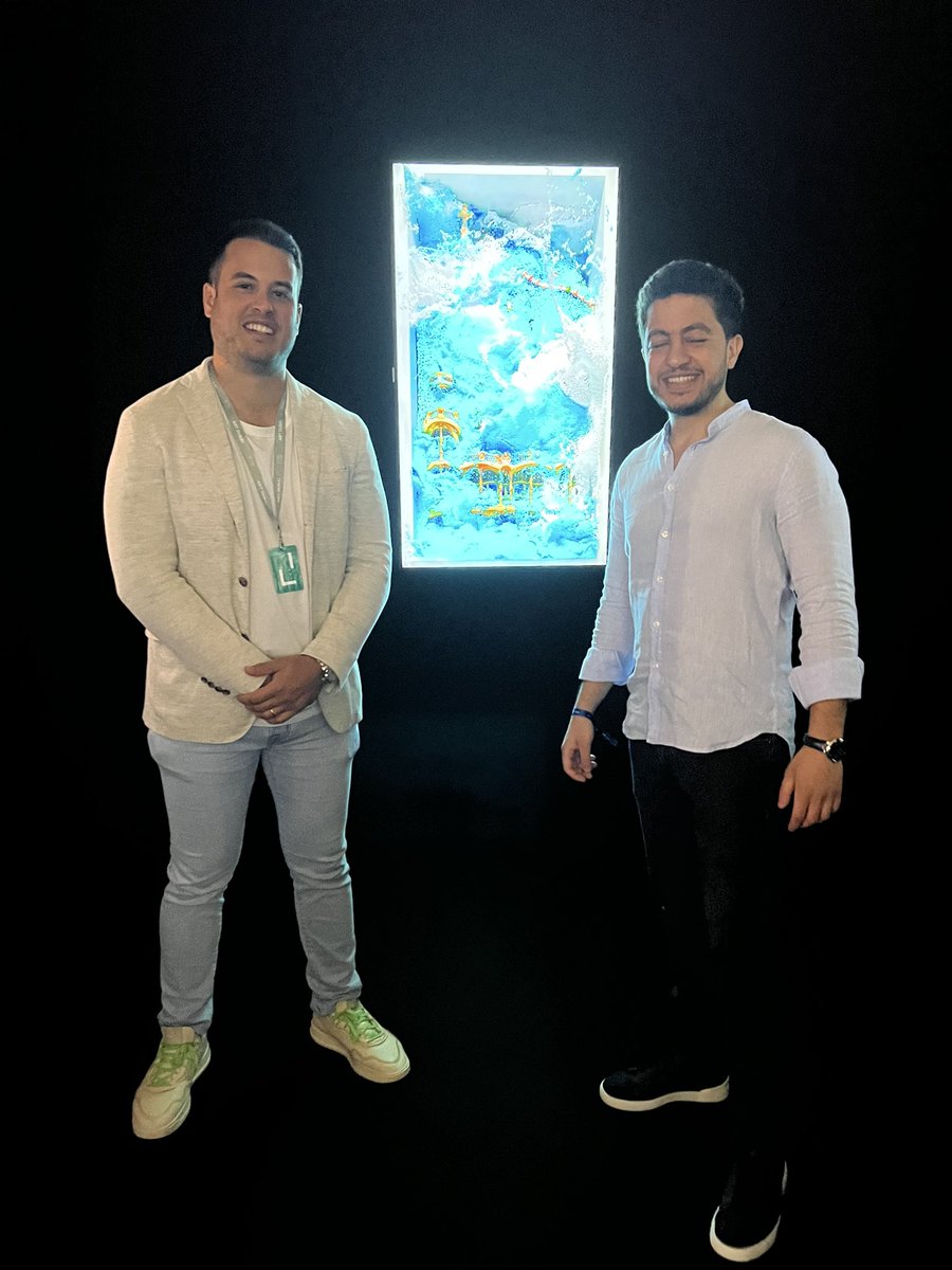 omar_sarieddine's tweet photo. With @ACthecollector at the @punk6529 exhibition at @artdubai. The epic NFT from their collection in the background is by @refikanadol 👌🏼 https://t.co/txaTU8G9HJ