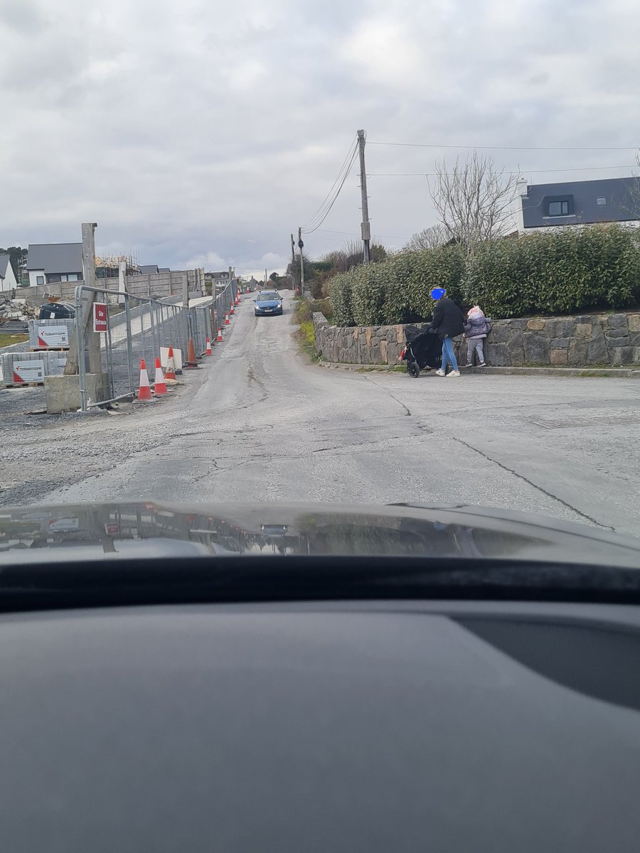sfeeney99's tweet photo. Footpath on left a year completed but still not open to public due to council not finishing, young child walked out in front of car on way up hill to Playground in Barna. One of numerous close calls at an Maolán estate, are council waiting for an accident before completing? https://t.co/zlOPlGZrmH