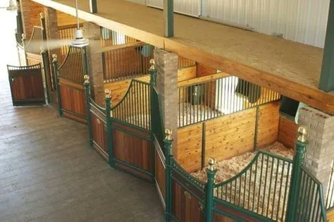 Warm wood blends beautifully with earthy emerald in this idyllic stable. 🐴