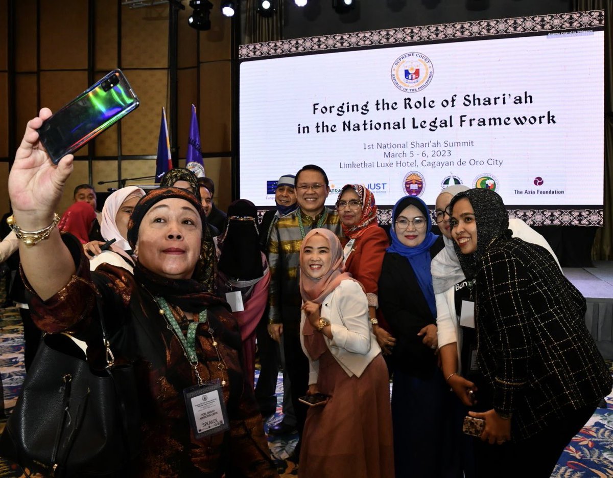SCPh_PIO's tweet photo. Court of Appeals Justice Anisah Amanodin-Umpa, the first female Moro Justice of the CA, takes a selfie with Justice Japar B. Dimaampao, the second Moro to have been appointed to the Supreme Court, and other participants of the 1st National Shari'ah Summit. #1stShariahSummit. https://t.co/3o4UI0ba4C