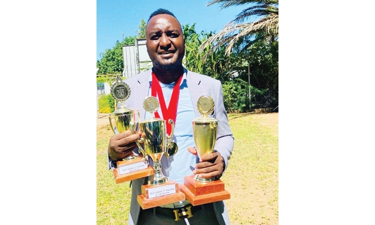 TheNamibian's tweet photo. YOUTH CENTRAL | Mike Ashipala (31), who teaches English grades 11 and 12 pupils at Oshigambo Senior Secondary School English, has been named the overall winner of the Oshikoto regional academic awards. https://t.co/s0YSYlolgQ https://t.co/Uoa32XSdcL